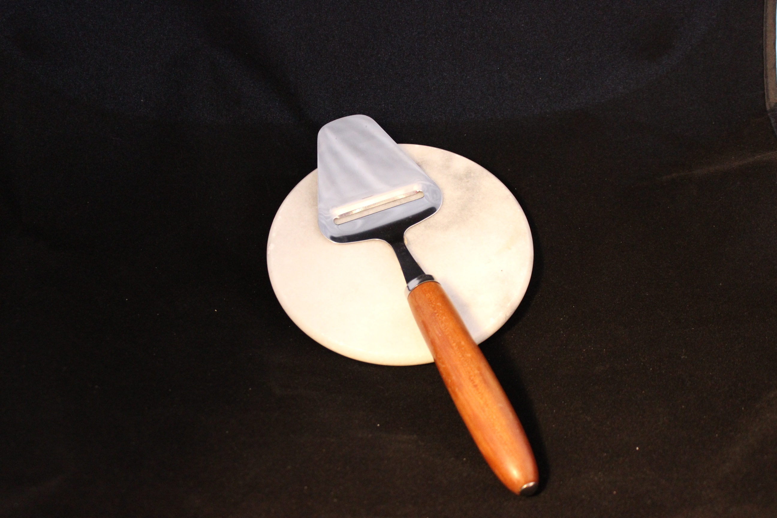 Cheese slicer with cutting board.